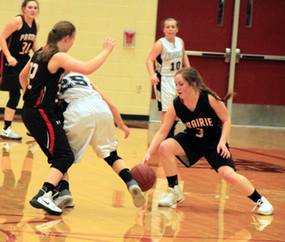 Angela Wemhoff makes one of her 14 steals against Horseshoe Bend. Also shown are Sydney Bruner, in background, and India Peery at left.