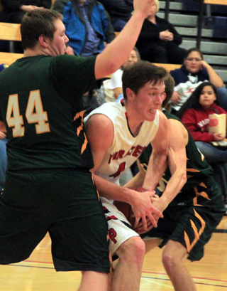 Patrick Chmelik battles for the ball in the district game against Potlatch.