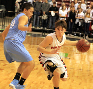 Brandon Anderson drives past Lapwais Cameron Shawl in the championship game.