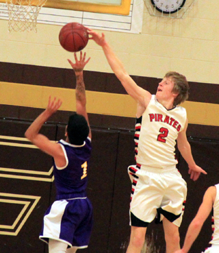 Tyson Schlader blocks the shot of a Wilder player at State.