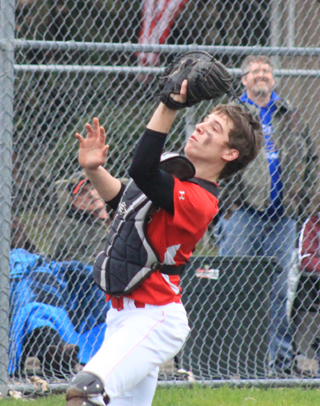 Catcher Brandon Anderson catches a foul popup.