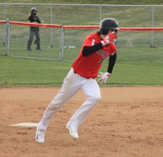 Nick Mager heads for third with an RBI triple in the Glenns Ferry game.