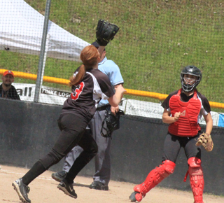 Josie Peery charges in to catch a popup against Kendrick at District.