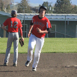 Spencer Schumacher in his home run trot as the C.V. player checks out where the ball landed.