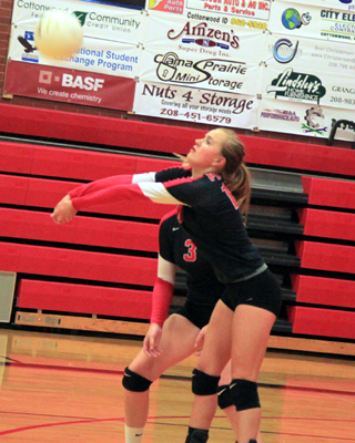 Jordyn Higgins makes a pass against Genesee. Behind her is her cousin Leah Higgins.