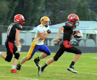 Damian Forsmann outraces Salmon Rivers Canyon Harper to the goal line on a 38 yard TD run. Nick Mager is trailing on the play.