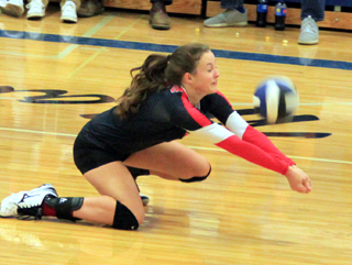 Alexis Hiler digs a serve at Orofino.