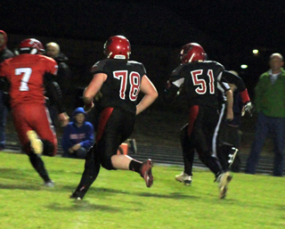 Lineman Jace Perrin, 51, got to score a touchdown late in the Council game on a tackle eligible play. Also shown is Dereck Arnzen, 78.
