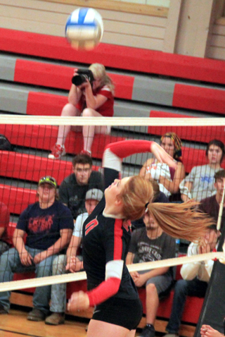 Josie Peery spikes the ball at C.V.