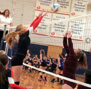 Leah Higgins makes a block against Kamiah at the Grangeville Tournament.