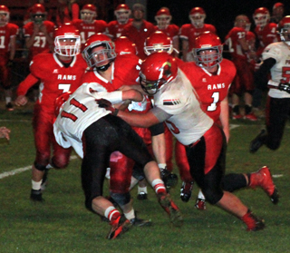 Nick Mager and Caleb McWilliams combine to tackle a C.V. ballcarrier.