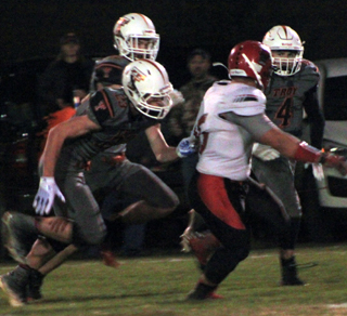 Caleb McWilliams powers through this attempted tackle for a huge gain.