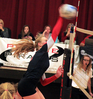 Leah Higgins power slams the ball against Orofino.