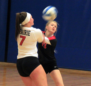 Sydney Bruner and Theresa Wemhoff nearly collide as both go look to make a pass in the Kamiah match at District.