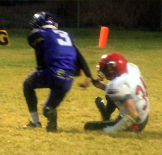 Jayce Huling maintains a hold on the sleeve of the Wilder quarterback and eventually got the tackle for a 15 yard loss.