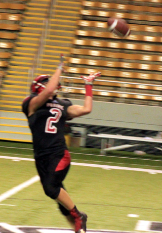 Jake Stubbers is about to catch a long pas from Spencer Schumacher that he turned into a 65 yard touchdown play.