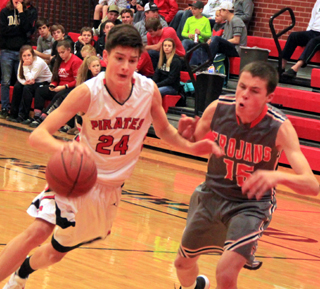Devin Ross drives past a Troy defender.