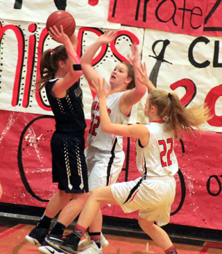 India Peery and Theresa Wemhoff double team a Grangeville player.