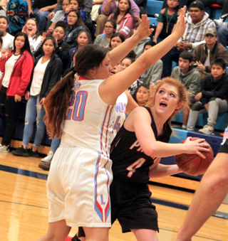 Josie Peery looks to get a shot up past a Lapwai defender.
