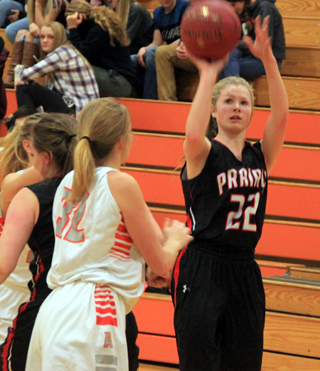 Theresa Wemhoff shoots as Sydney Bruner battles for rebounding position.