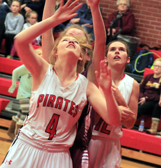 Josie Peery gets the inside position for a rebound in the Kamiah game. Sarah Ross is in back.