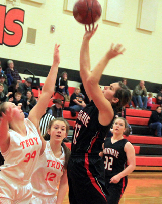 Sarah Ross scores 2 points at Troy. Also shown is India Peery.