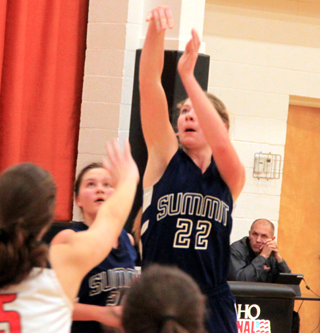Summits Claira Osborne puts up a shot in the play-in game at Kendrick. Also shown is Taylor Lustig.