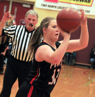 India Peery is about to sink one of her four 3-pointers in the Shoshone game at State.