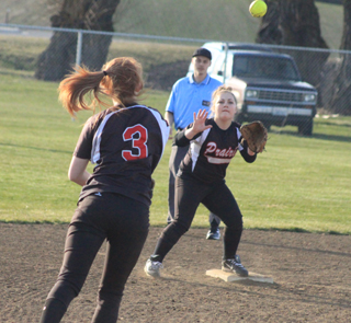 Josie Peery tosses to her sister Jade for a forceout at second at Colton.