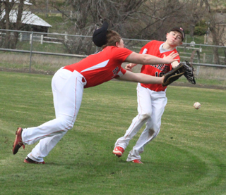 Neither 1st Baseman Dereck Arnzen nor 2nd Baseman Conner Schwartz could get to this short fly ball at Pomeroy. Schwartz wound up injuring his knee on the play and had to come out of the game.