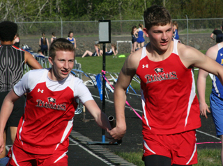 Damian Forsmann passes to Derik Shears at the Lapwai meet last Tuesday. Photo by Steve Wherry.