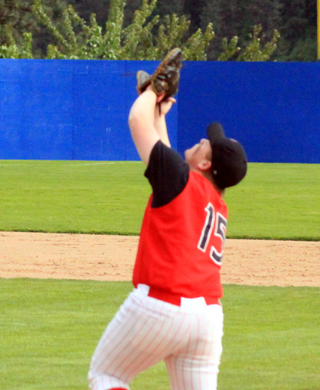 First baseman Dereck Arnzen settles under an infield popup against Genesee at District.