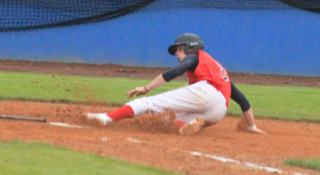 Nick Mager slides into home with a run in the Horseshoe Bend game at State.
