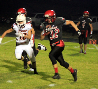Cole Martin races past a Troy defender on his way to the end zone. In the background is Derik Shears.