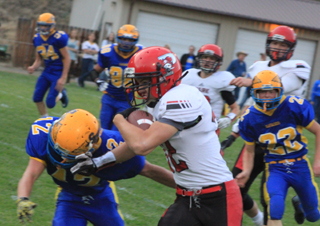 Cole Martin wards off a defender which broke him loose for a 65 yard TD run.