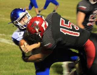 Caleb McWilliams tackles a Genesee ballcarrier.