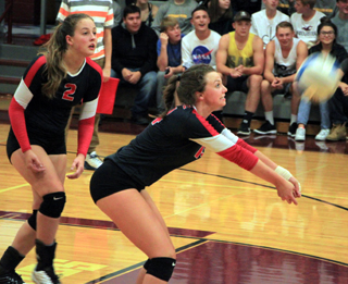 Kristyna Krogh makes a pass against Kamiah as Alexis Hiler looks on.