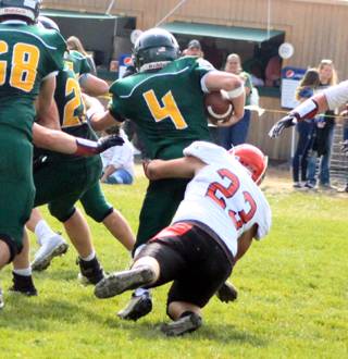 Hayden Uhlenkott tackles Potlatchs quarterback. Part of a defensive effort that resulted in Prairies second straight shutout.
