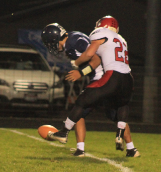 Owen Anderson knocked the ball loose from Lapwai quarterback Payton Sobotta as he made a sack. Dean Johnson wound up recovering the fumble.