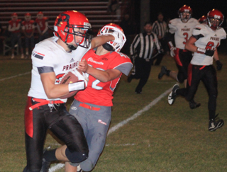 Cole Martin stiffarms a C.V. defender. Also shown are Dylan Schumacher and Carson Schmidt.