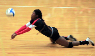 Madison Shears dove to the floor to dig up a Troy serve and wound up scoring a kill for Prairie on this play.