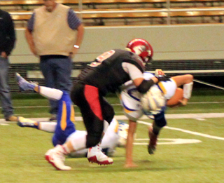 Dean Johnson with one of his 4.5 sacks of Raft Rivers quarterback.
