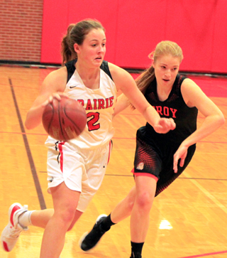 Alexis Hiler drives past a Troy defender.