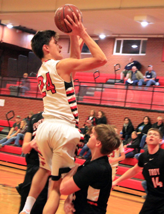 Devin Ross gets way above Troys defenders for a jump shot. He had a big week, leading the Pirates in scoring in all 3 games played.