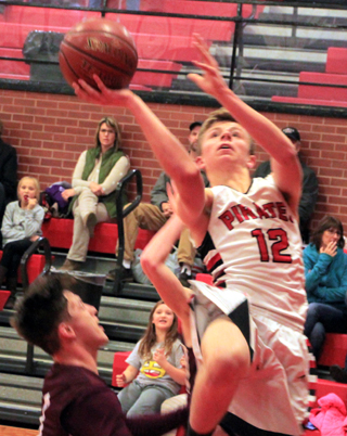 Sam Mager goes for a lay-up against Kamiah.