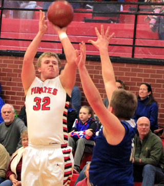 Spencer Schumacher shoots against Genesee.