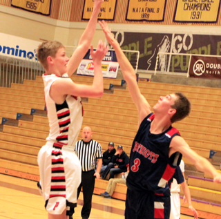 Dylan Schumacher shoots over a Liberty Charter defender.