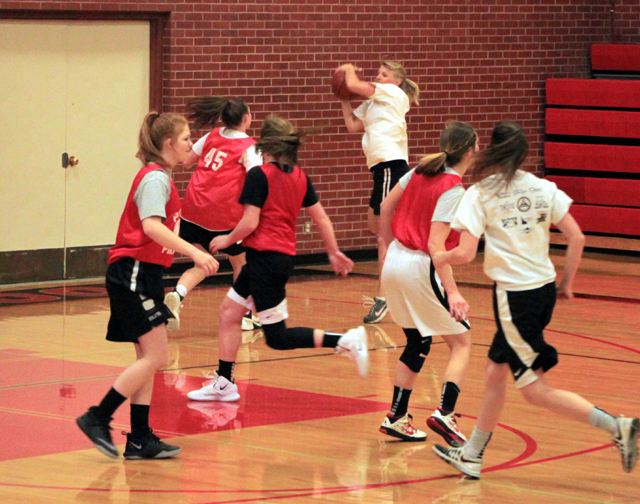 Theresa Wemhoff takes the ball to the hoop after making a steal against Grangeville. Jordyn Higgins is trailing the play.