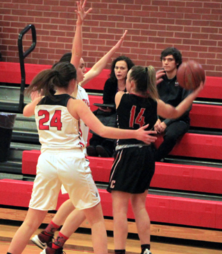 Kristyna Krogh and Ciara Chaffee double team a Clarkston player. Prairies press turned the game their way in the second quarter.