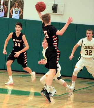 Dylan Schumacher intercepts a Potlatch pass. At left is Devin Ross.
